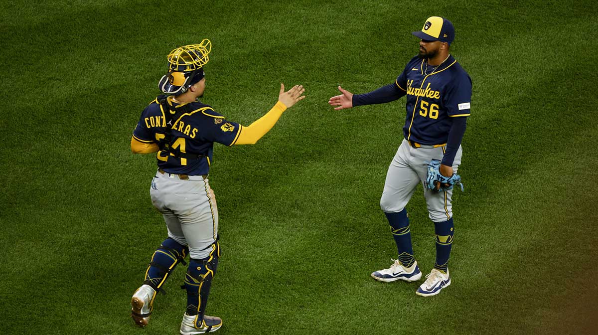 Milwaukee Brewers pitcher Grant Anderson (56) shakes hands with catcher William Contreras (24) following a victory against the Seattle Mariners at T-Mobile Park. The Brewers extended their winning streak to 11, claiming MLB's best record this late. The brewers are trying to rewrite or make history.