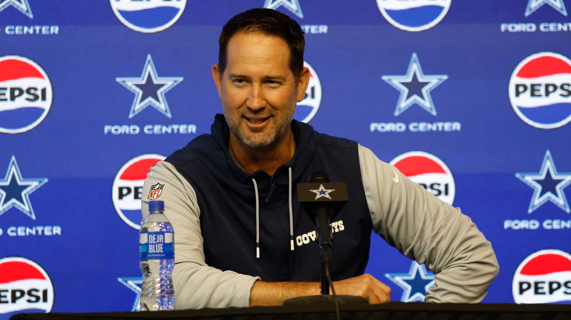 Dallas Cowboys head coach Brian Schottenheimer addresses the media before practice at the Ford Center at the Star Training Facility in Frisco, Texas.
