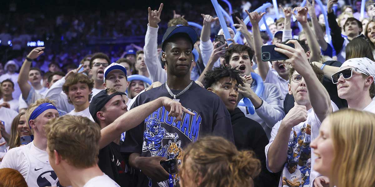 Brigham Young Cougars 2025/-2026 top recruit Aj Dybantsa joins the student section during the second half of the game against the West Virginia Mountaineers at Marriott Center.