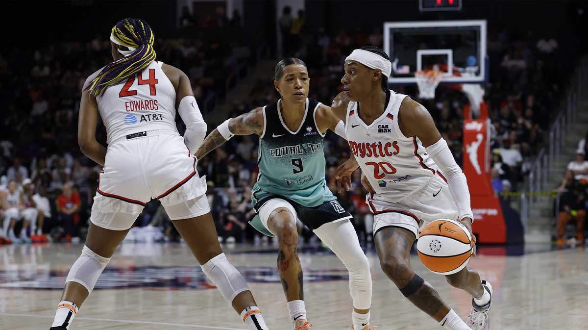 Washington Mystics guard Brittney Sykes drives to the basket past New York Liberty guard Natasha Cloud in the second half at CareFirst Arena.