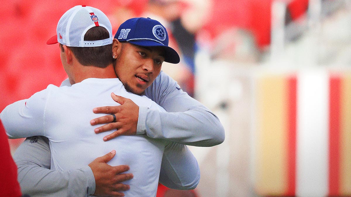 Dallas Cowboys quarterback Trey Lance (19) hugs San Francisco 49ers quarterback Brock Purdy (13) before the game at Levi's Stadium.