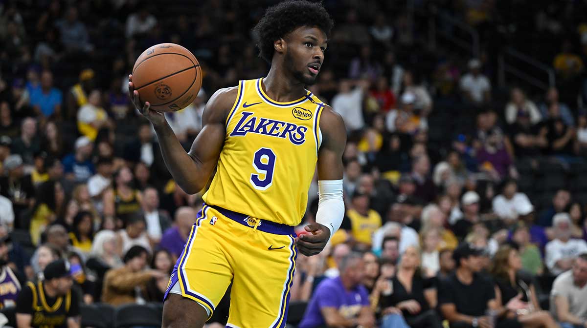 Los Angeles Lakers guard Bronny James (9) looks to pass against the Minnesota Timberwolves during the second half at Acrisure Arena.