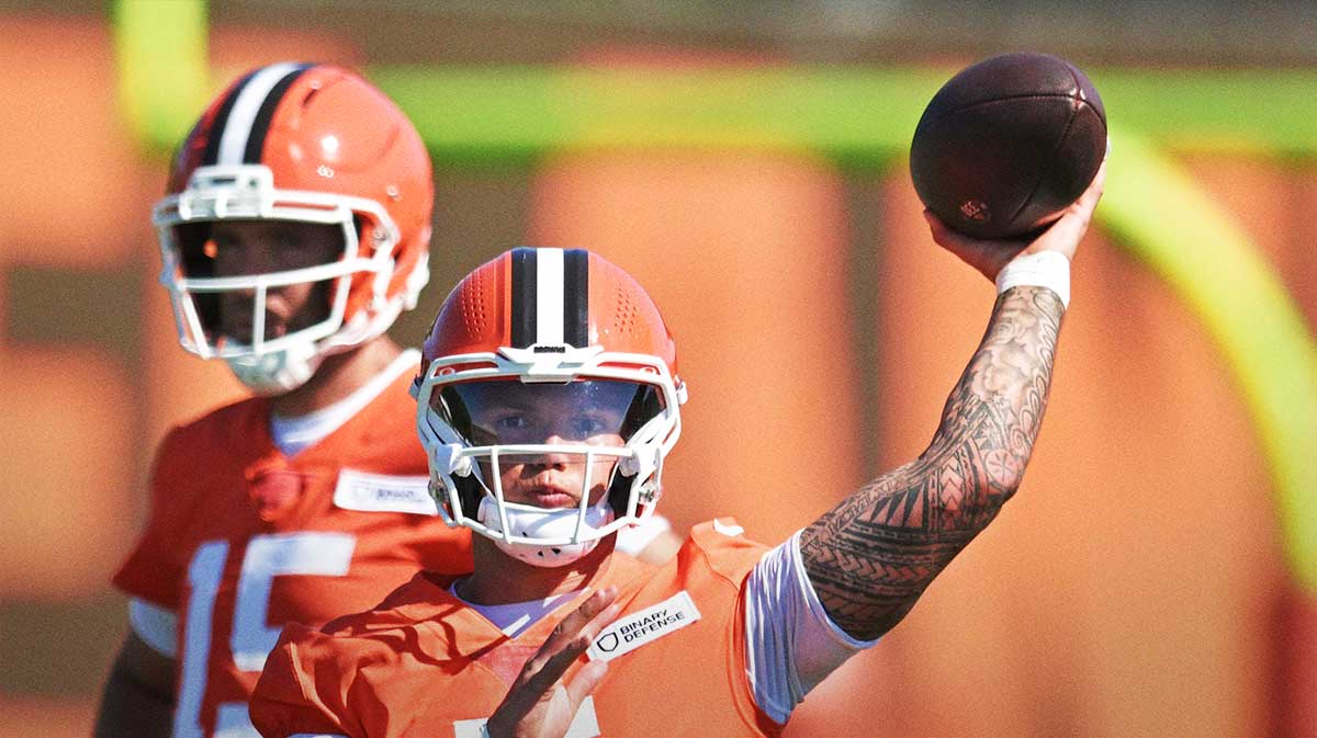 Cleveland Browns quarterback Dillon Gabriel (5) throws a pass as quarterback Joe Flacco (15) looks on during training camp at CrossCountry Mortgage Campus.