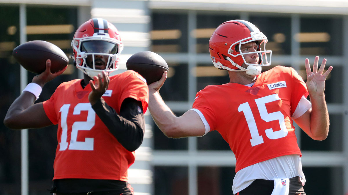 Cleveland Browns quarterback Joe Flacco (15) and quarterback Shedeur Sanders (12) look downfield during NFL training camp at CrossCountry Mortgage Campus, Wednesday, July 30, 2025, in Berea, Ohio.