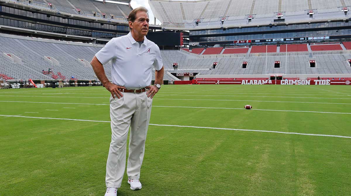 Alabama football coach Nick Saban stands on the turf inside Bryant-Denny Stadium during his team's media day in 2019.