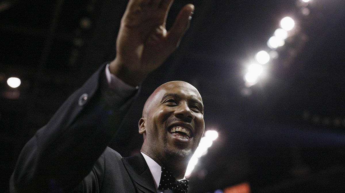 San Antonio Spurs former player Bruce Bowen waves to fans during the first half against the Minnesota Timberwolves at the AT&T Center.