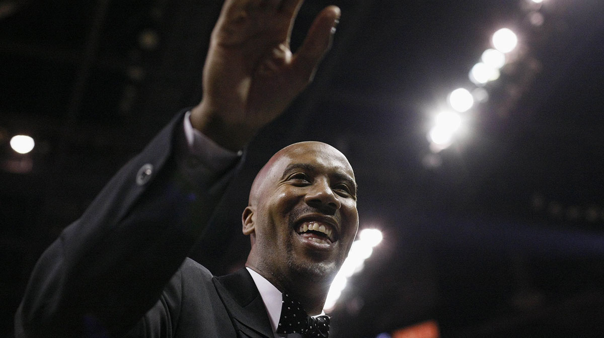 San Antonio Spurs former player Bruce Bowen waves to fans during the first half against the Minnesota Timberwolves at the AT&T Center.