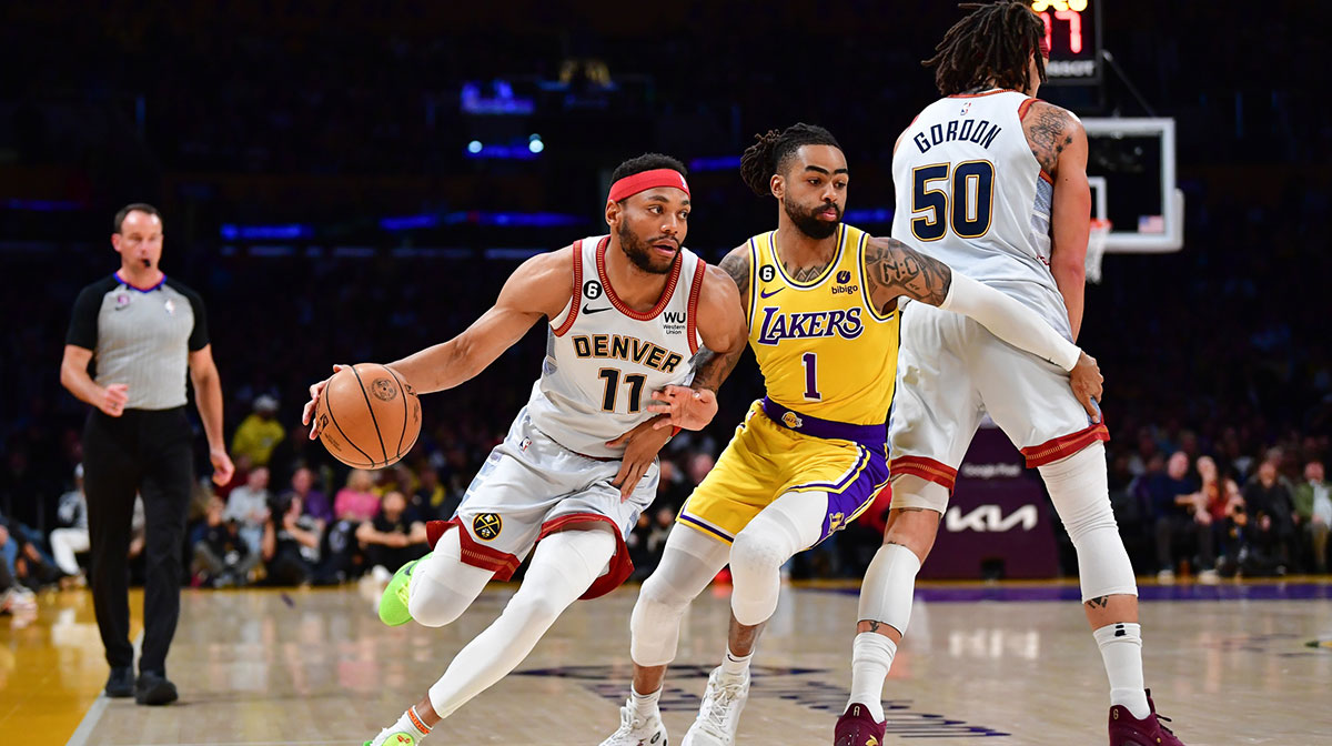 Denver Nuggets forward Bruce Brown (11) drives to the basket against Los Angeles Lakers guard D'Angelo Russell (1) during the first quarter in game four of the Western Conference Finals for the 2023 NBA playoffs at Crypto.com Arena.