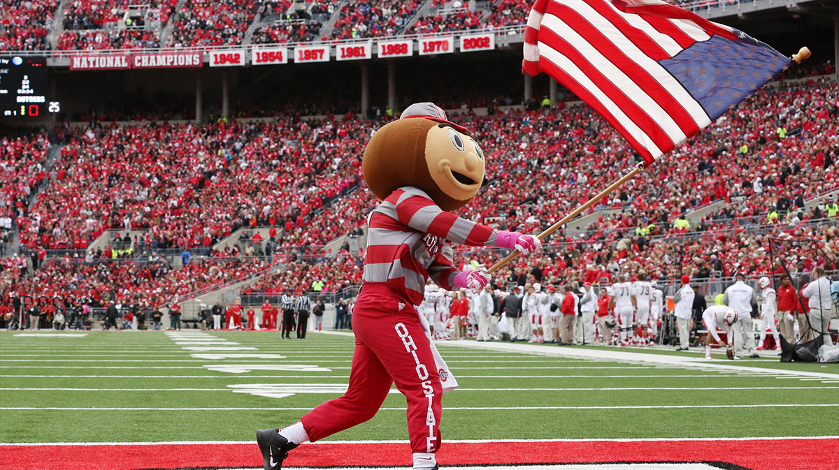 Brutus carries the flag before an NCAA college football game between The Ohio State Buckeyes and the Rutgers Scarlet Knights