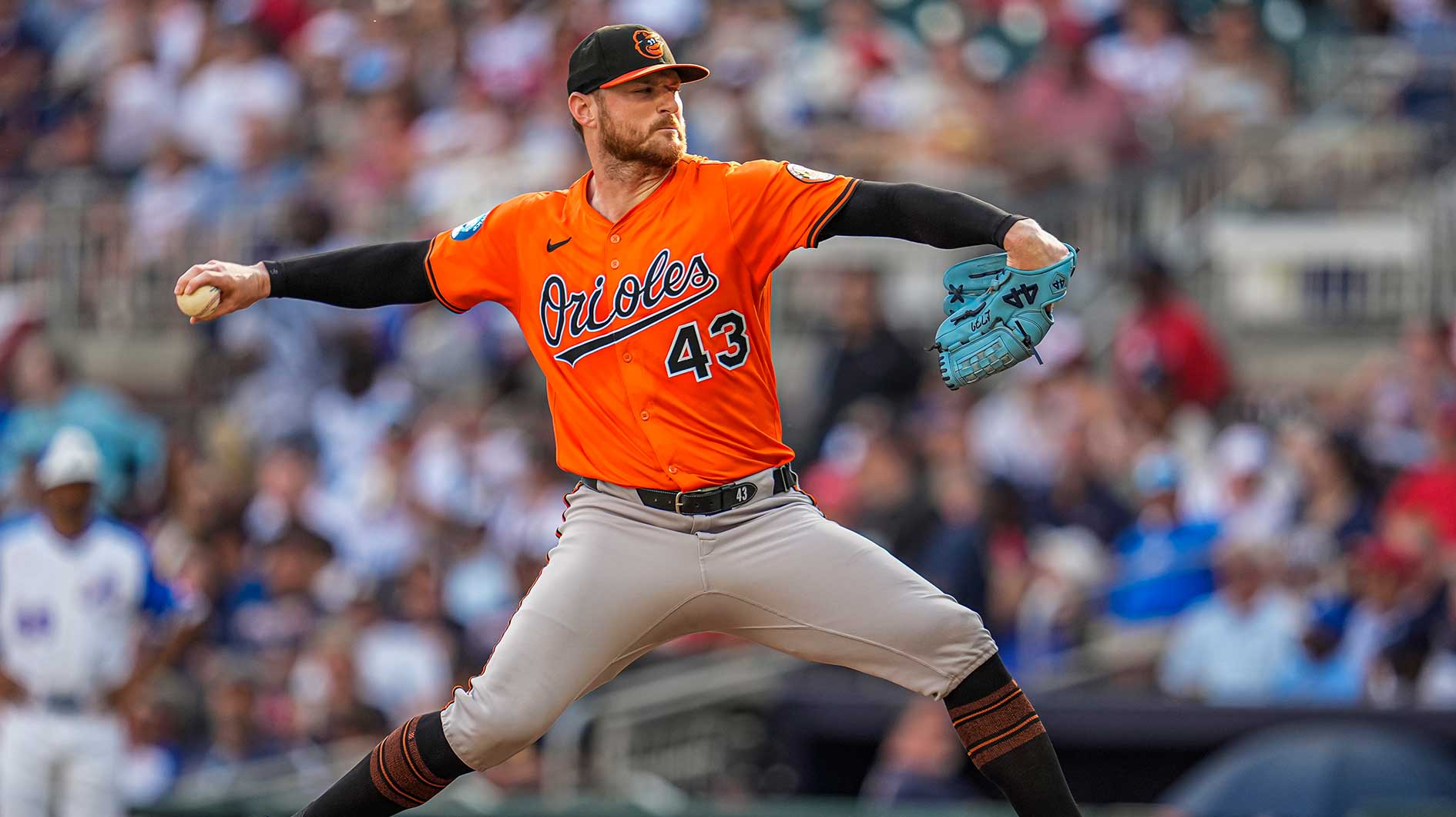 Baltimore Orioles relief pitcher Bryan Baker (43) pitches against the Atlanta Braves during the eighth inning at Truist Park.
