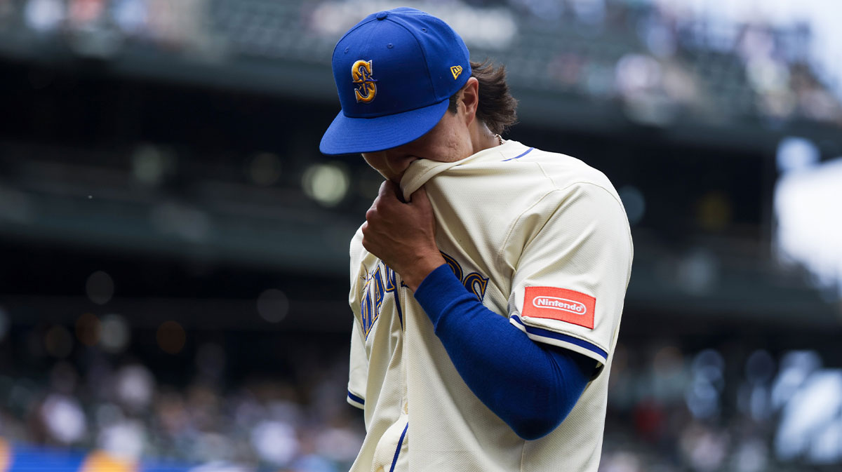 Seattle Mariners starting pitcher Bryan Woo (22) returns to the dugout following the final out of the top of the fifth inning at T-Mobile Park.