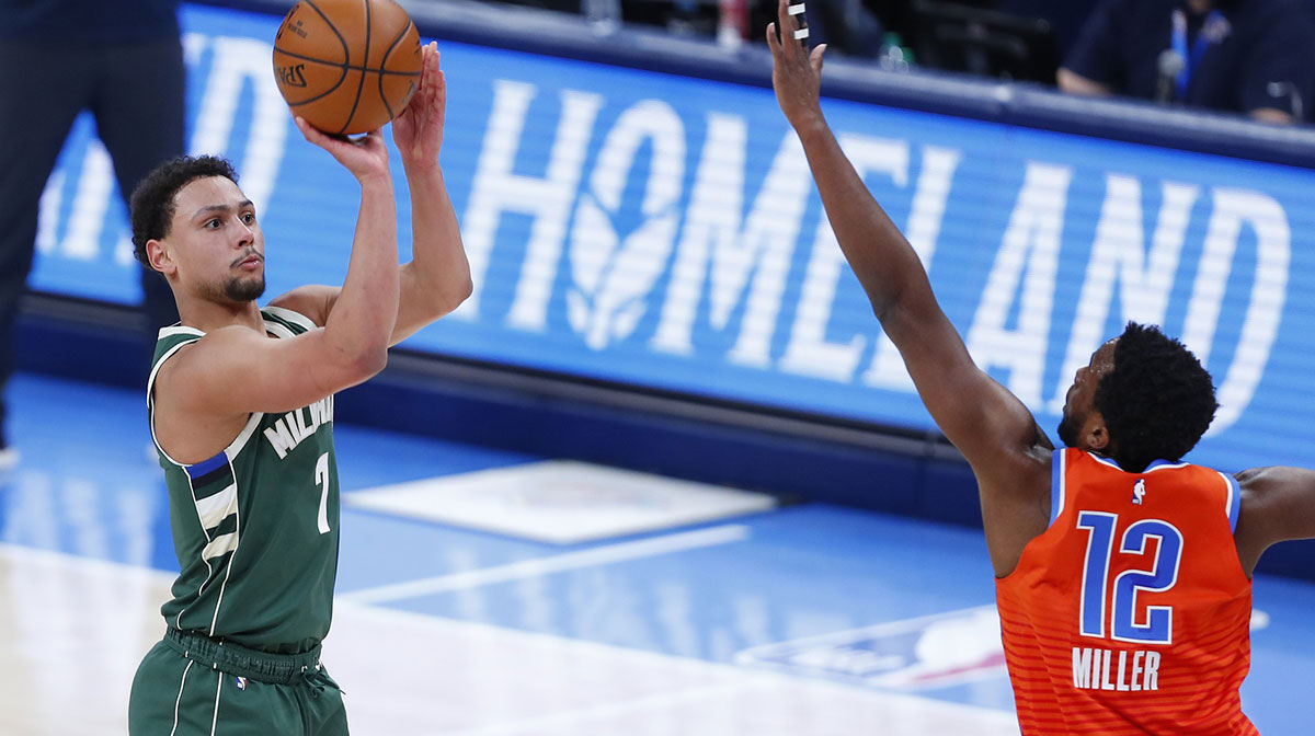 Milwaukee Bucks guard Bryn Forbes (7) shoots a three-point shot as Oklahoma City Thunder forward Darius Miller (12) defends during the first half at Chesapeake Energy Arena.
