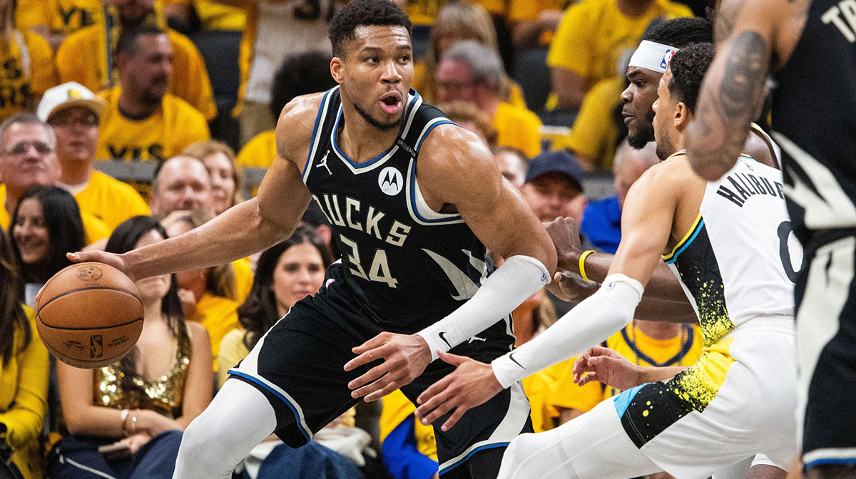 Bucks forward Giannis Antetokounmpo (34) dribbles the ball while Indiana Pacers forward Jarace Walker (5) defends during game five of the first round for the 2024 NBA Playoffs at Gainbridge Fieldhouse
