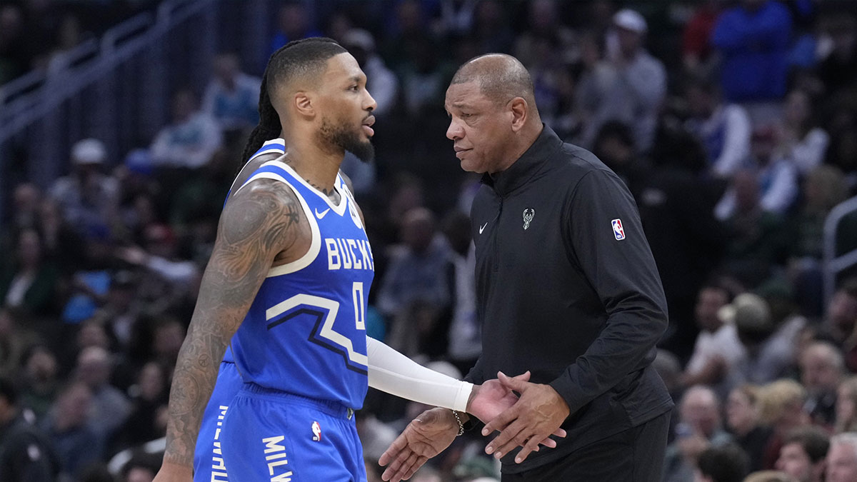 Milwaukee Bucks head coach Doc Rivers congratulates Milwaukee Bucks guard Damian Lillard (0) in the second half at Fiserv Forum.