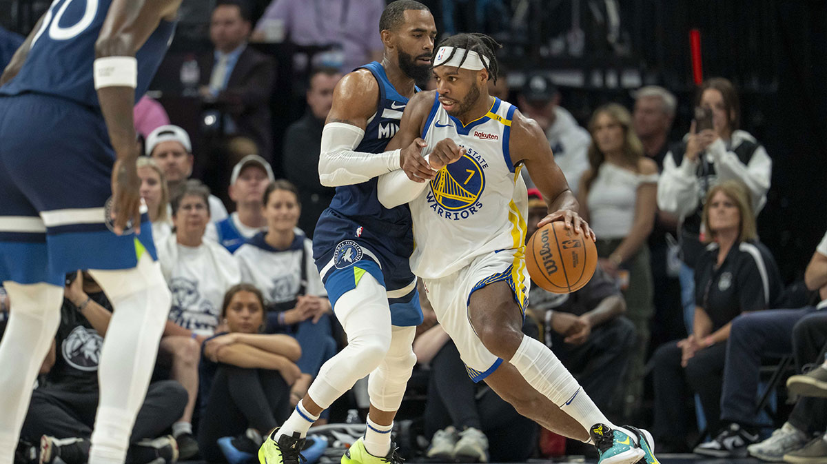 Golden State Warriors guard Buddy Hield (7) dribbles the ball as Minnesota Timberwolves guard Mike Conley (10) plays defense in the first half during game five of the second round for the 2025 NBA Playoffs