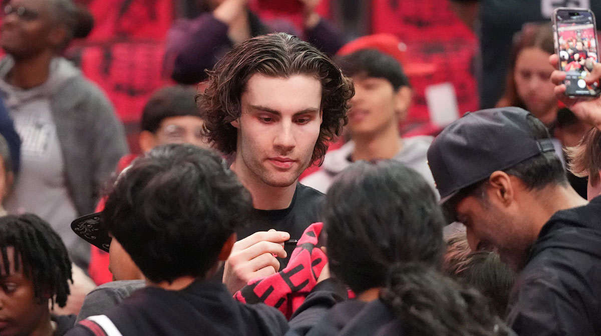 Chicago Bulls guard Josh Giddey (3) signs autographs before the game against the Miami Heat at United Center.