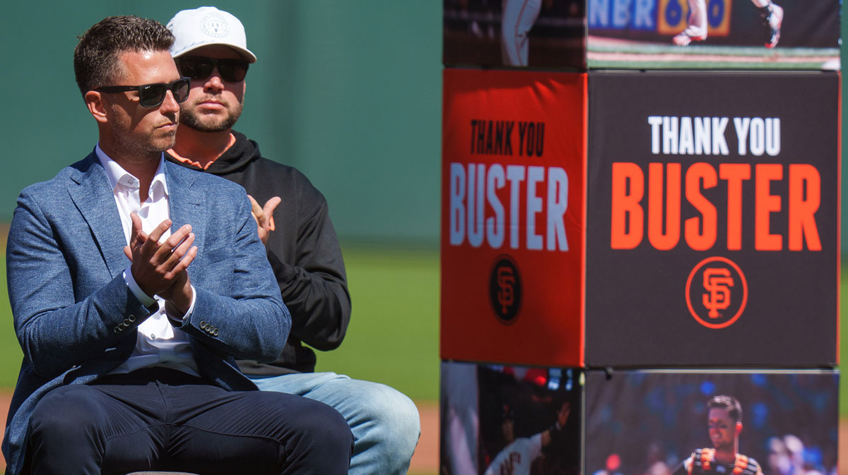 Buster Posey listens to speakers during the ceremony to honor him before the start of the game against the St. Louis Cardinals at Oracle Park.