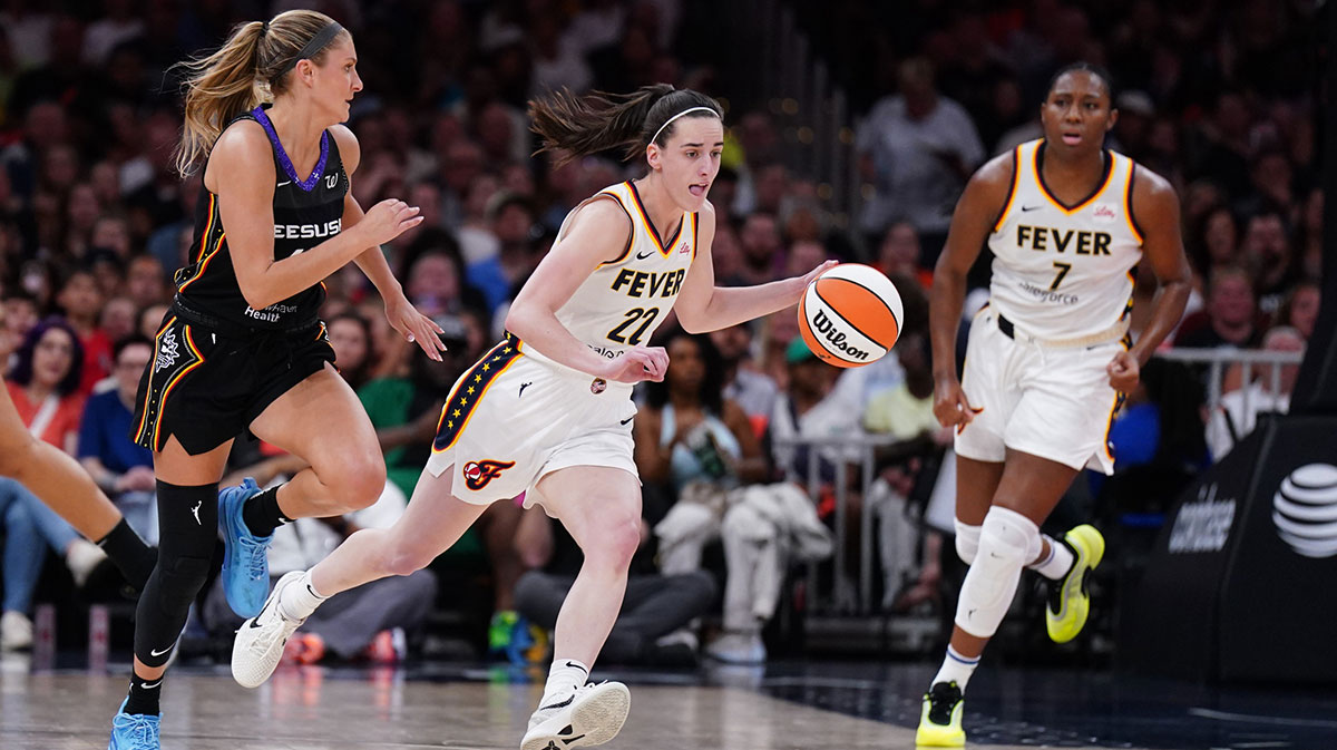 Indiana Fever guard Caitlin Clark (22) returns the ball against Connecticut Sun guard Jacy Sheldon (4) in the second half at TD Garden.
