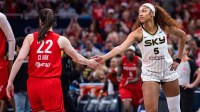 Indiana Fever guard Caitlin Clark (22) and Chicago Sky forward Angel Reese (5) shake hands before the game at Gainbridge Fieldhouse.