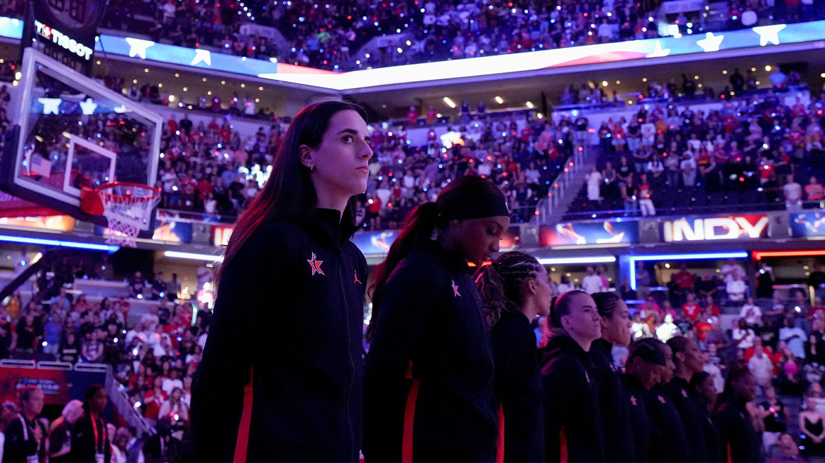 Indiana Fever's Caitlin Clark (22) stands with her team during the national anthem ahead of the WNBA All-Star Game.