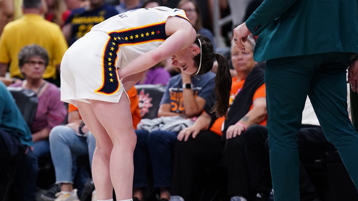 Indiana Fever guard Caitlin Clark (22) reacts with a possible injury after a play against the Connecticut Sun in the second half at TD Garden.