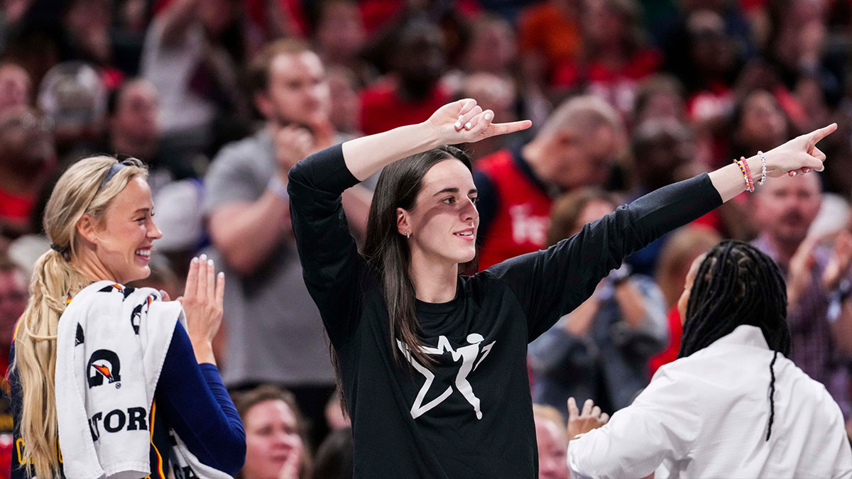 Indiana Fever guard Sophie Cunningham (8) and Indiana Fever guard Caitlin Clark (22) celebrate from the bench