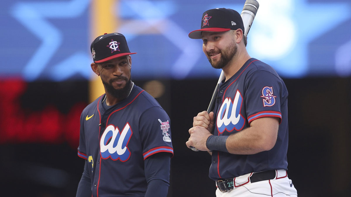 American League outfielder Byron Buxton (25) of the Minnesota Twins and American League catcher Cal Raleigh (29) of the Seattle Mariners are introduced during the 2025 Home Run Derby at Truist Park.