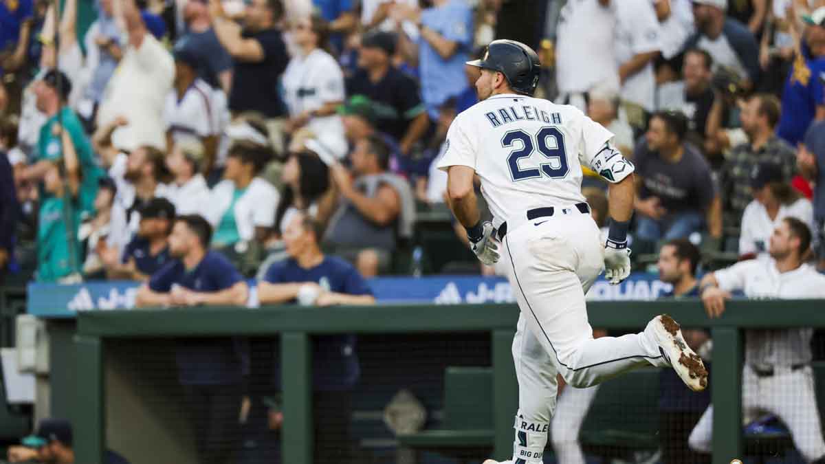 Seattle Mariners catcher Cal Raleigh (29) hits a solo-home run against the Milwaukee Brewers during the sixth inning at T-Mobile Park.