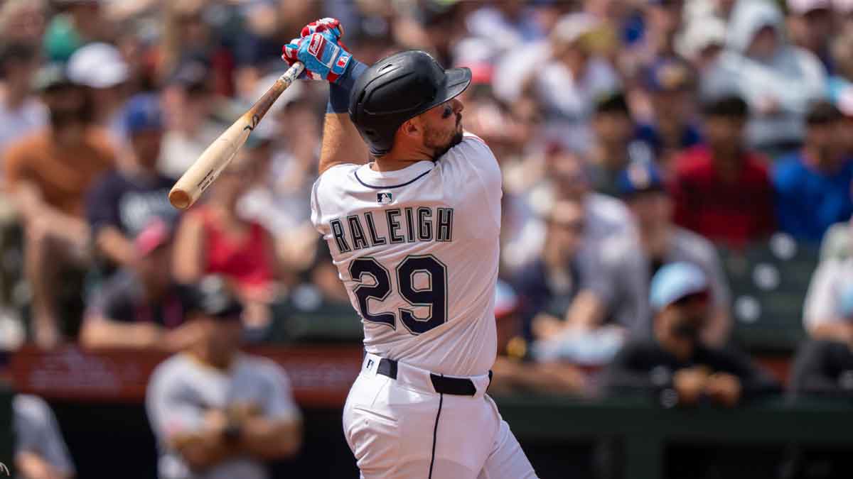 Jul 4, 2025; Seattle, Washington, USA; Seattle Mariners designated hitter Cal Raleigh (29) hits a solo home run during the sixth inning against the Pittsburgh Pirates at T-Mobile Park.