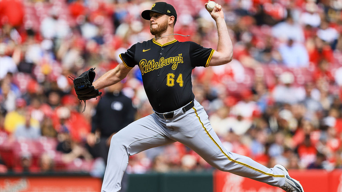 Pittsburgh Pirates relief pitcher Caleb Ferguson (64) pitches against the Cincinnati Reds in the eighth inning at Great American Ball Park.
