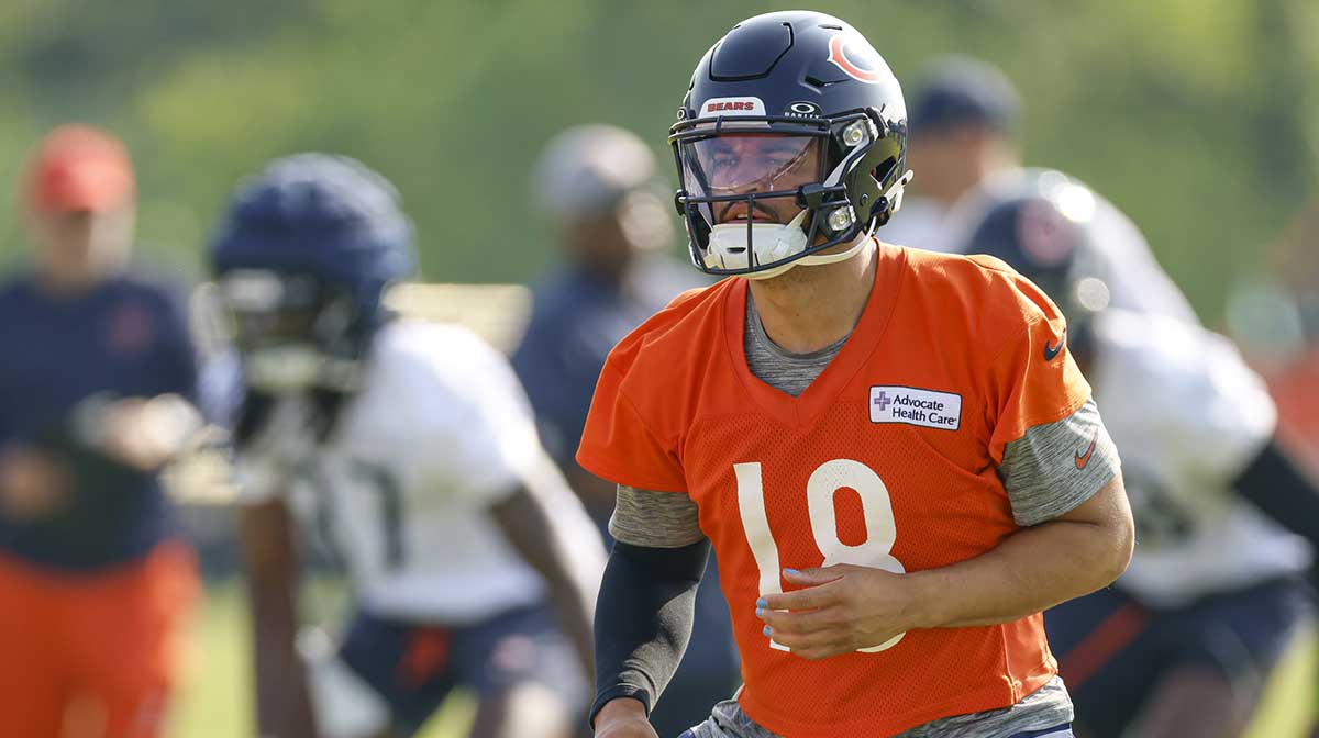 Chicago Bears quarterback Caleb Williams (18) warms up during training camp at Halas Hall.