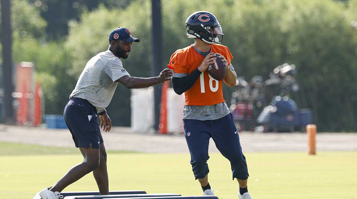 Chicago Bears quarterback Caleb Williams (18) looks to pass the ball during training camp at Halas Hall.