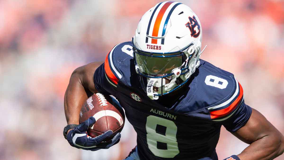 Auburn Tigers wide receiver Cam Coleman (8) turns upfield after a catch eventually scoring a touchdown as Auburn Tigers take on Louisiana-Monroe Warhawks at Jordan-Hare Stadium in Auburn, Ala., on Saturday, Nov. 16, 2024. Auburn Tigers lead Louisiana-Monroe Warhawks 24-0 at halftime.