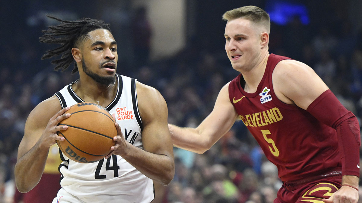  Brooklyn Nets guard Cam Thomas (24) dribbles beside Cleveland Cavaliers guard Sam Merrill (5) in the first quarter at Rocket Arena