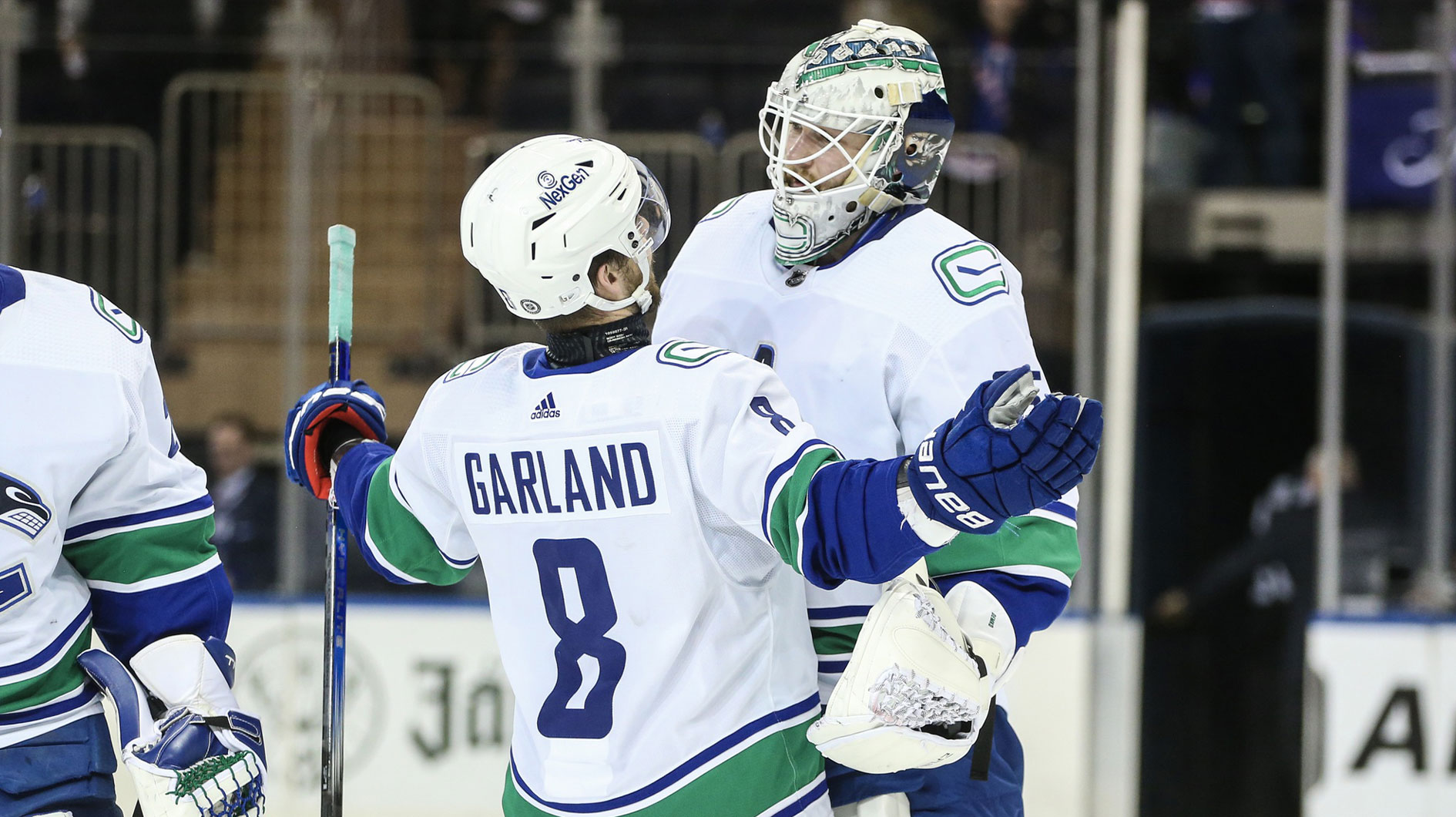 Vancouver Canucks right wing Conor Garland (8) and goaltender Thatcher Demko (35) celebrate after defeating the New York Rangers 6-3 at Madison Square Garden.