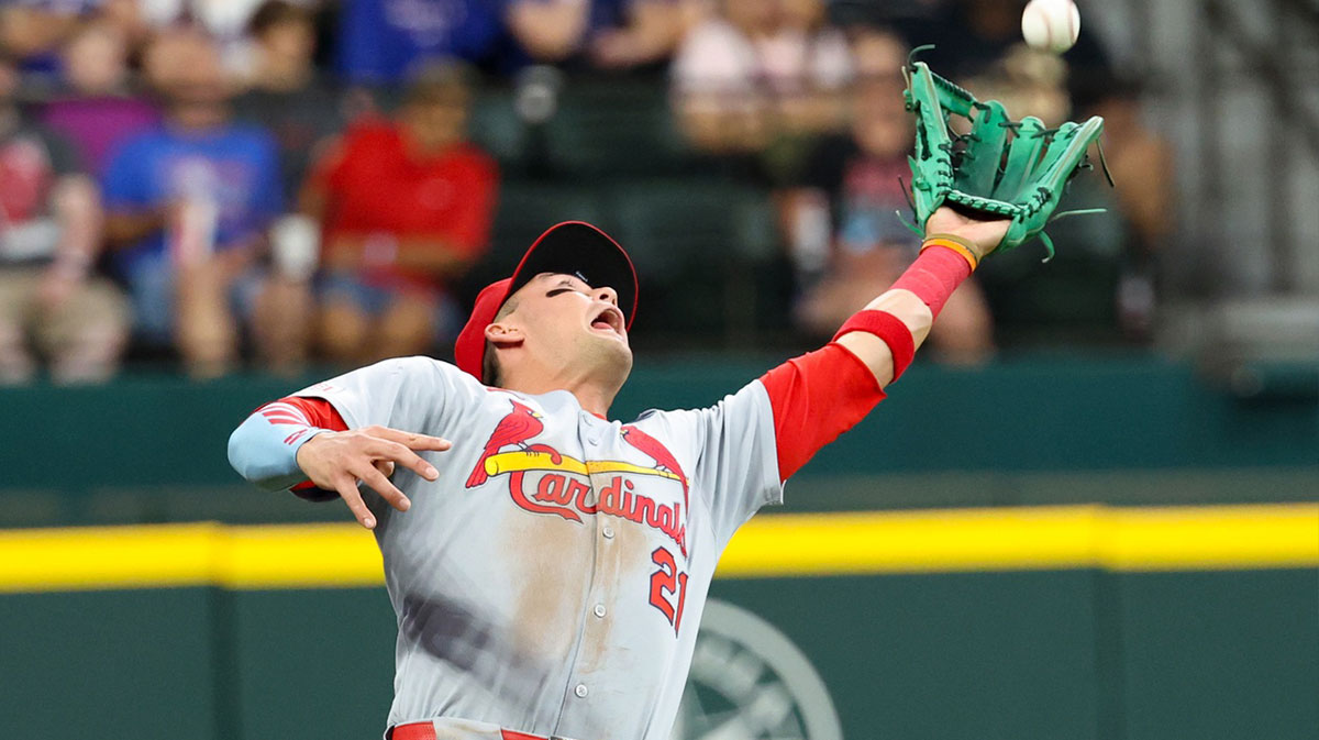 St. Louis Cardinals left fielder Lars Nootbar (21) makes a catch during the first inning against the Texas Rangers at Globe Life Field. Cardinals face potential fire sale ahead of the MLB trade deadline, with Astros and Phillies targeting Lars Nootbaar among trade candidates.