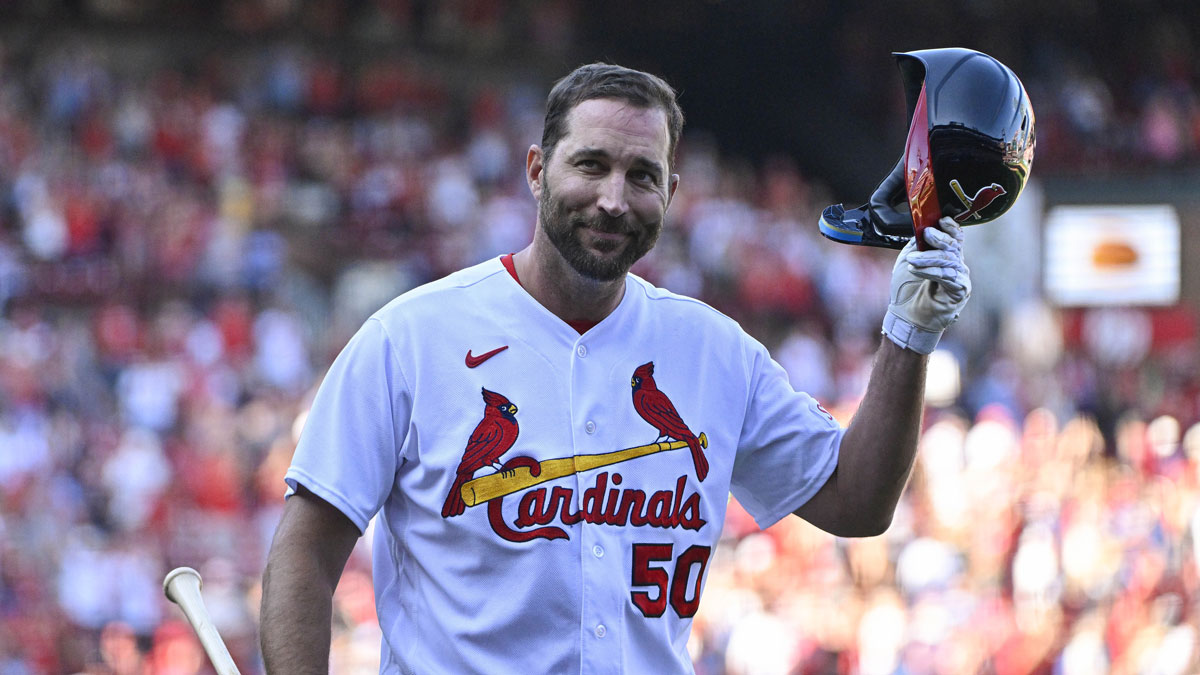 St. Louis Cardinals pinch hitter Adam Wainwright (50) tips his cap as he receives a standing ovation after his final at bat during the eighth inning against the Cincinnati Reds at Busch Stadium.