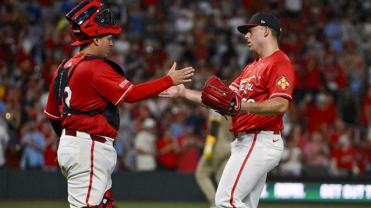 St. Louis Cardinals relief pitcher Ryan Helsley (56) celebrates with catcher Yohel Pozo (63) after the Cardinals defeated the San Diego Padres at Busch Stadium. Helsley is drawing strong interest from teams ahead of the MLB Trade deadline.