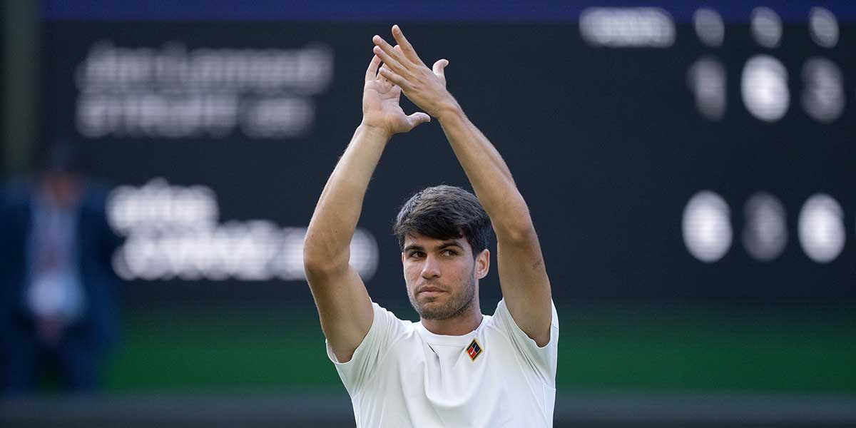 Carlos Alcaraz of Spain celebrates winning his match against Jan-Lennard Struff of Germany on day five at the All England Lawn Tennis and Croquet Club.