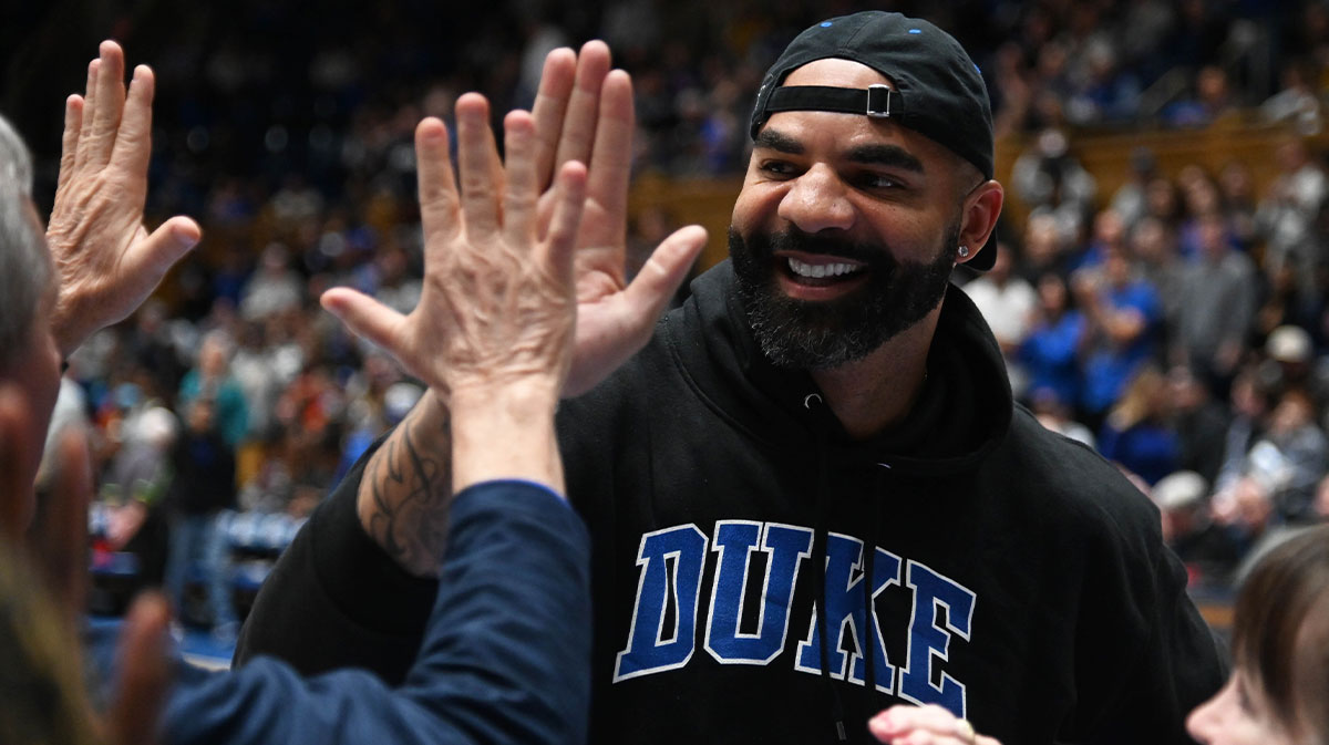 North Carolina, USA; Former Duke Blue Devils player Carlos Boozer greets fans during half-time after being inducted into the 2022 class of the Duke Hall of Fame at Cameron Indoor Stadium.