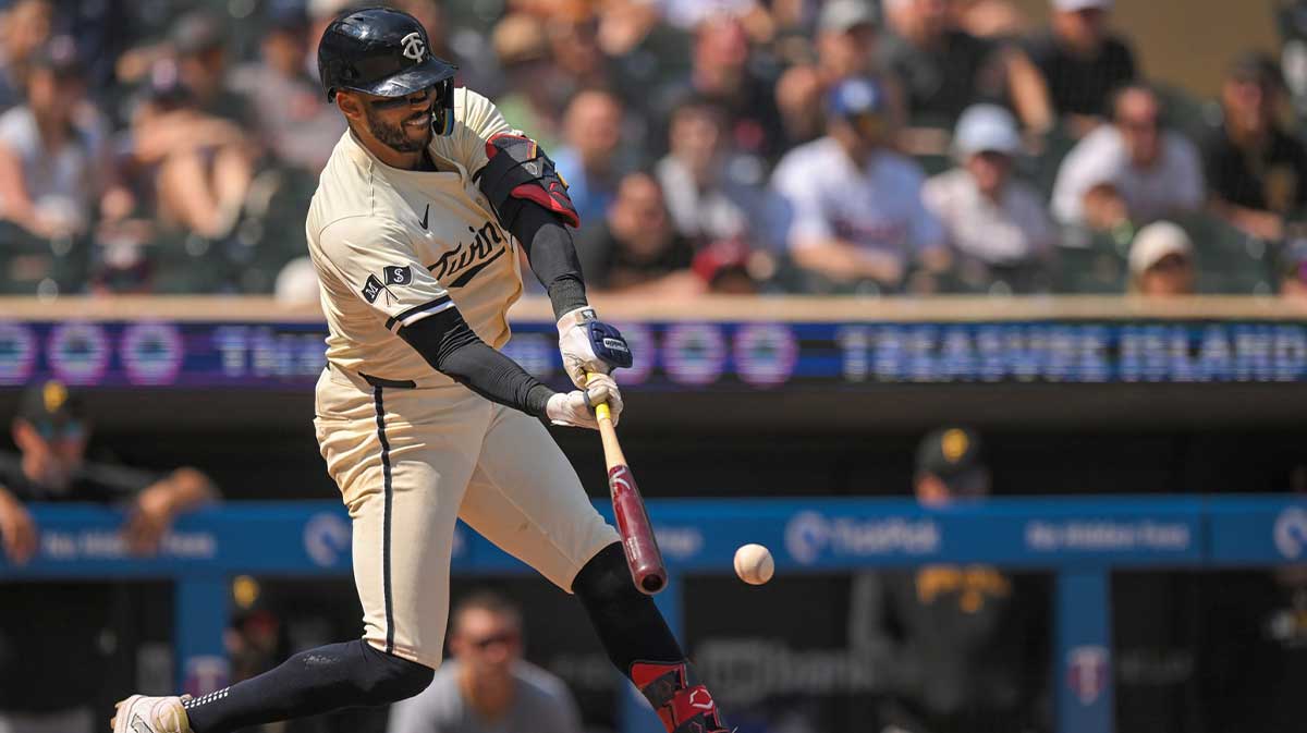 Jul 13, 2025; Minneapolis, Minnesota, USA; Minnesota Twins infielder Carlos Correa (4) hits a single against the Pittsburgh Pirates during the ninth inning at Target Field.