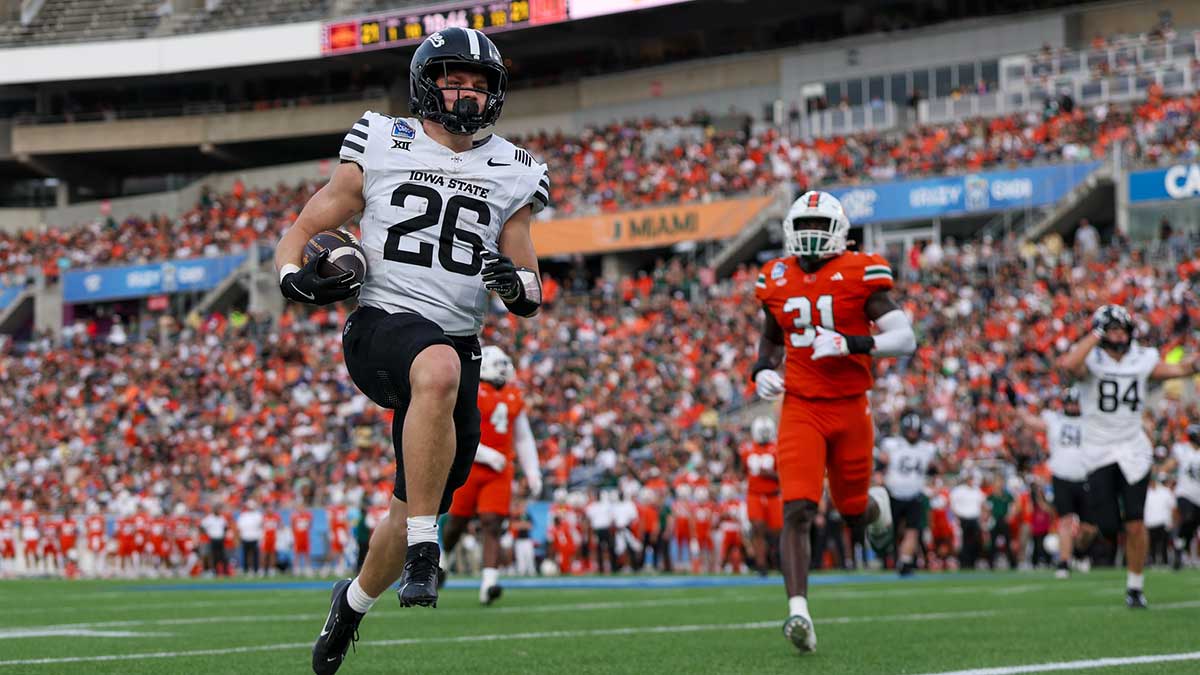 Iowa State Cyclones running back Carson Hansen (26) scores a touchdown against the Miami Hurricanes in the second quarter during the Pop Tarts bowl at Camping World Stadium.