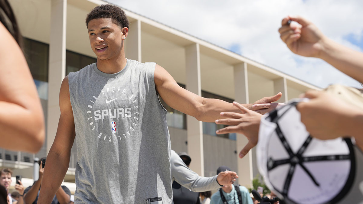 San Antonio Spurs first round draft pick Carter Bryant greets fans at Victory Capital Performance Center.
