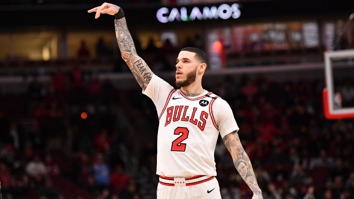 Chicago Bulls forward Lonzo Ball (2) hits a three point shot against Toronto Raptors guard Jamal Shead (23) during overtime at the United Center.