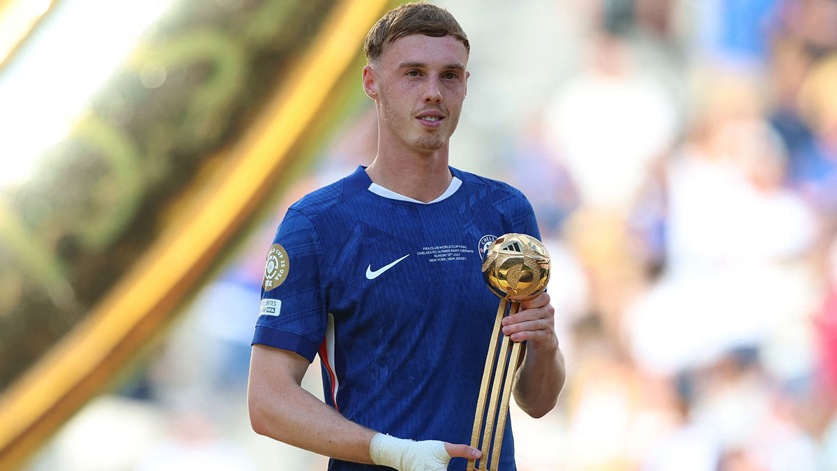 Chelsea FC midfielder Cole Palmer (10) poses with the golden ball trophy after the final of the 2025 FIFA Club World Cup at MetLife Stadium.