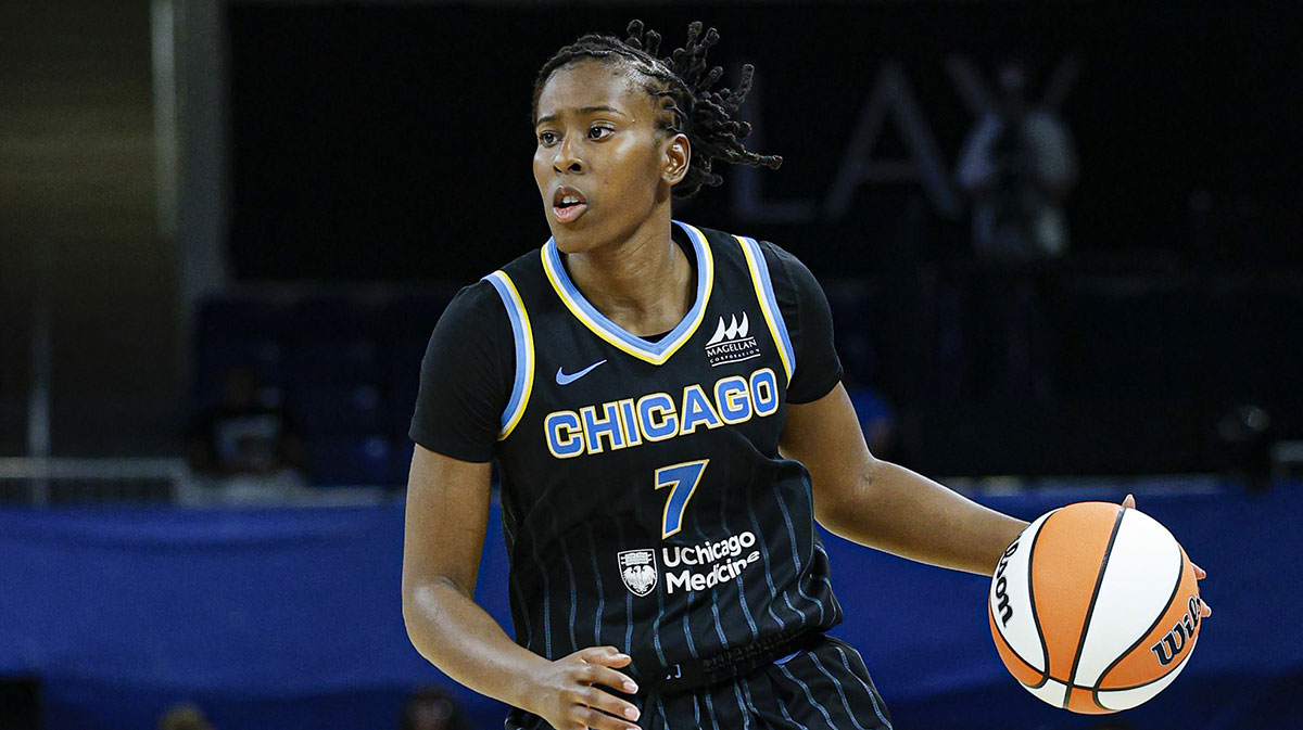 Chicago Sky guard Ariel Atkins (7) brings the ball up court against the Minnesota Lynx during the second half of a WNBA game.