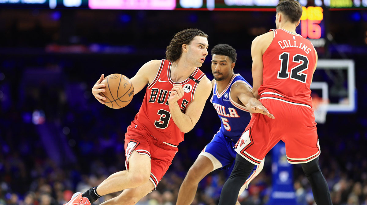 Chicago Bulls guard Josh Giddey (3) drives around Philadelphia 76ers guard Quentin Grimes (5) during the third quarter at Wells Fargo Center.