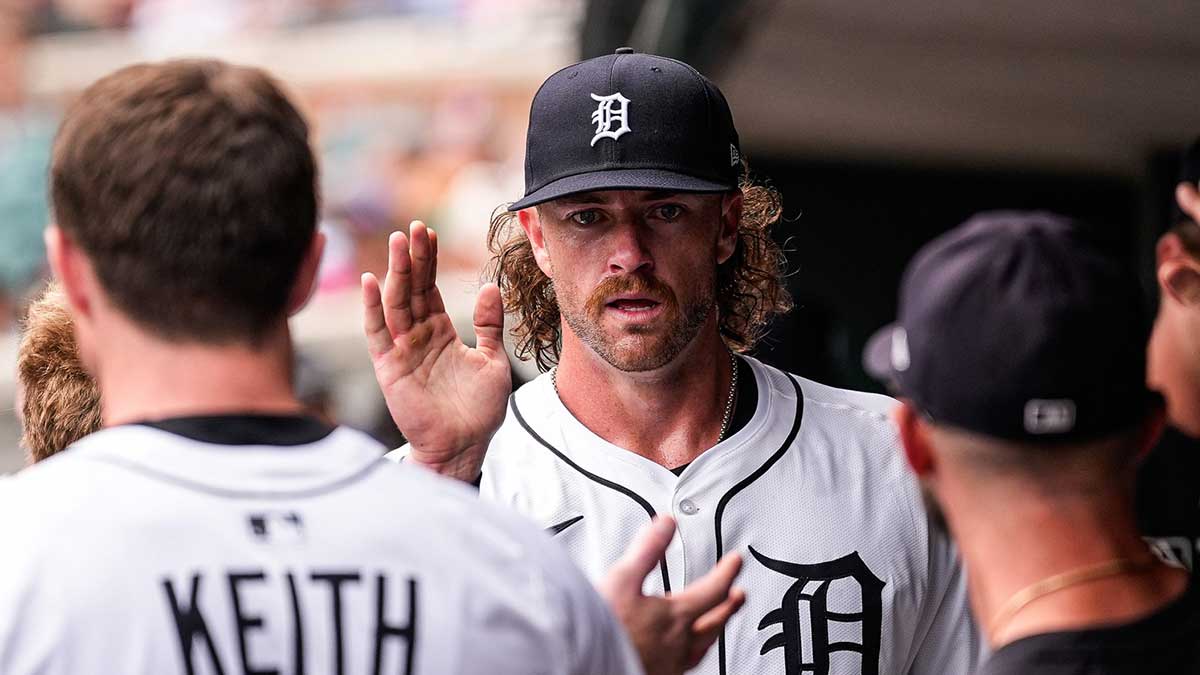 Detroit Tigers pitcher Chris Paddack (40) high-fives teammates in the dugout after pitching sixth inning against Detroit Tigers at Comerica Park
