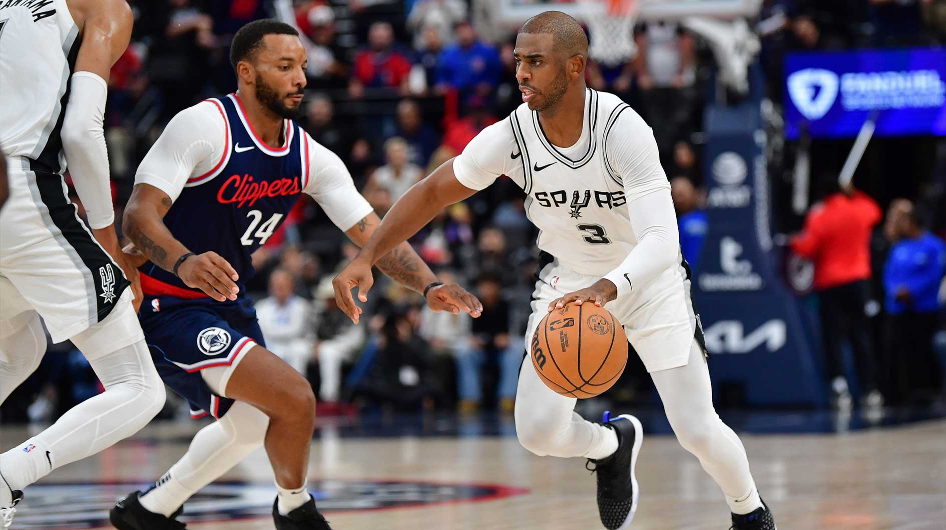 San Antonio Spurs guard Chris Paul (3) moves the ball against Los Angeles Clippers guard Norman Powell (24) during the second half at Intuit Dome.
