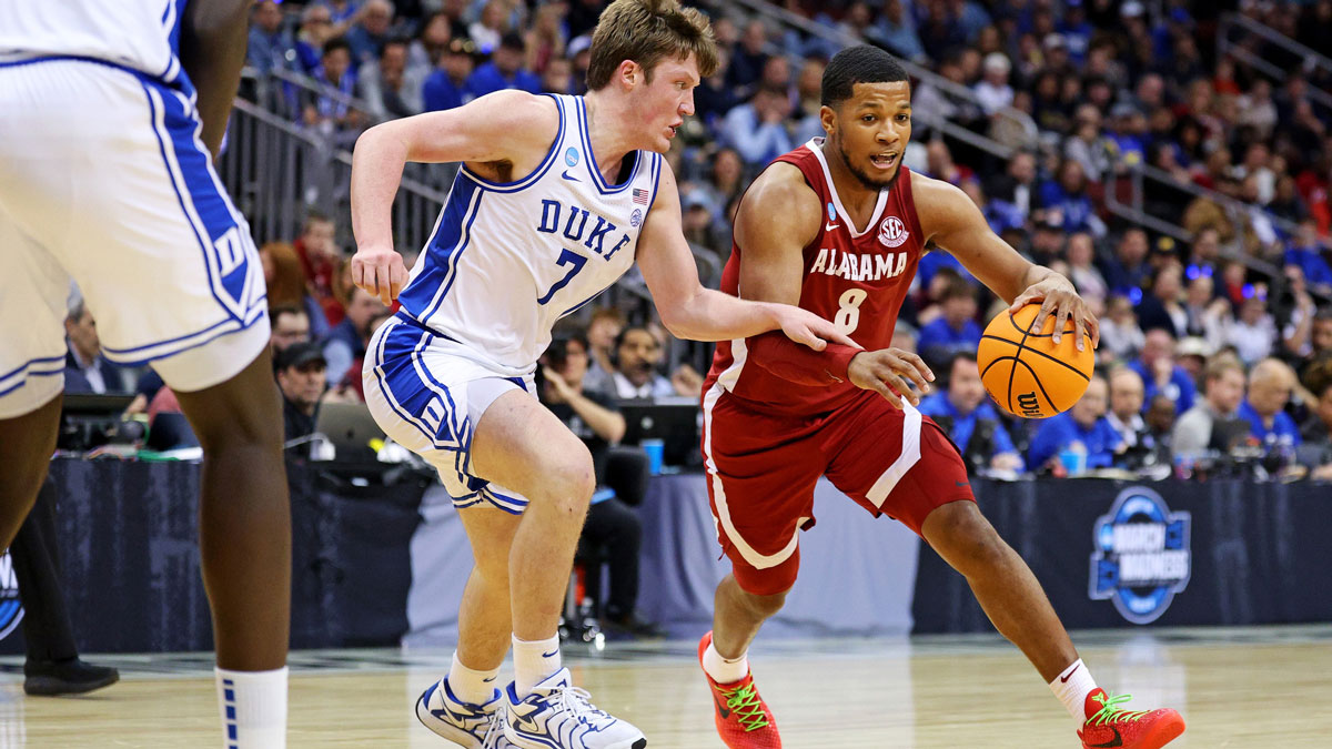 Alabama Crimson Tide guard Chris Youngblood (8) drives to the basket against Duke Blue Devils guard Kon Knueppel (7) during the second half in the East Regional final of the 2025 NCAA tournament at Prudential Center.